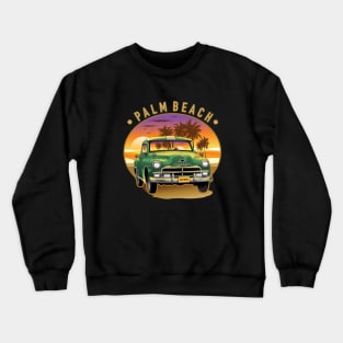 Green classic car on the palm beach in sunset Crewneck Sweatshirt